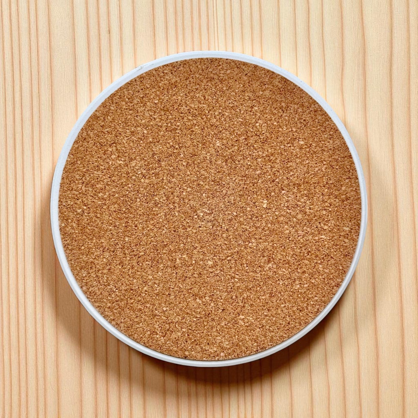 Back view of 4 inch Tulsa ceramic coaster showing cork backing for grip and surface protection
