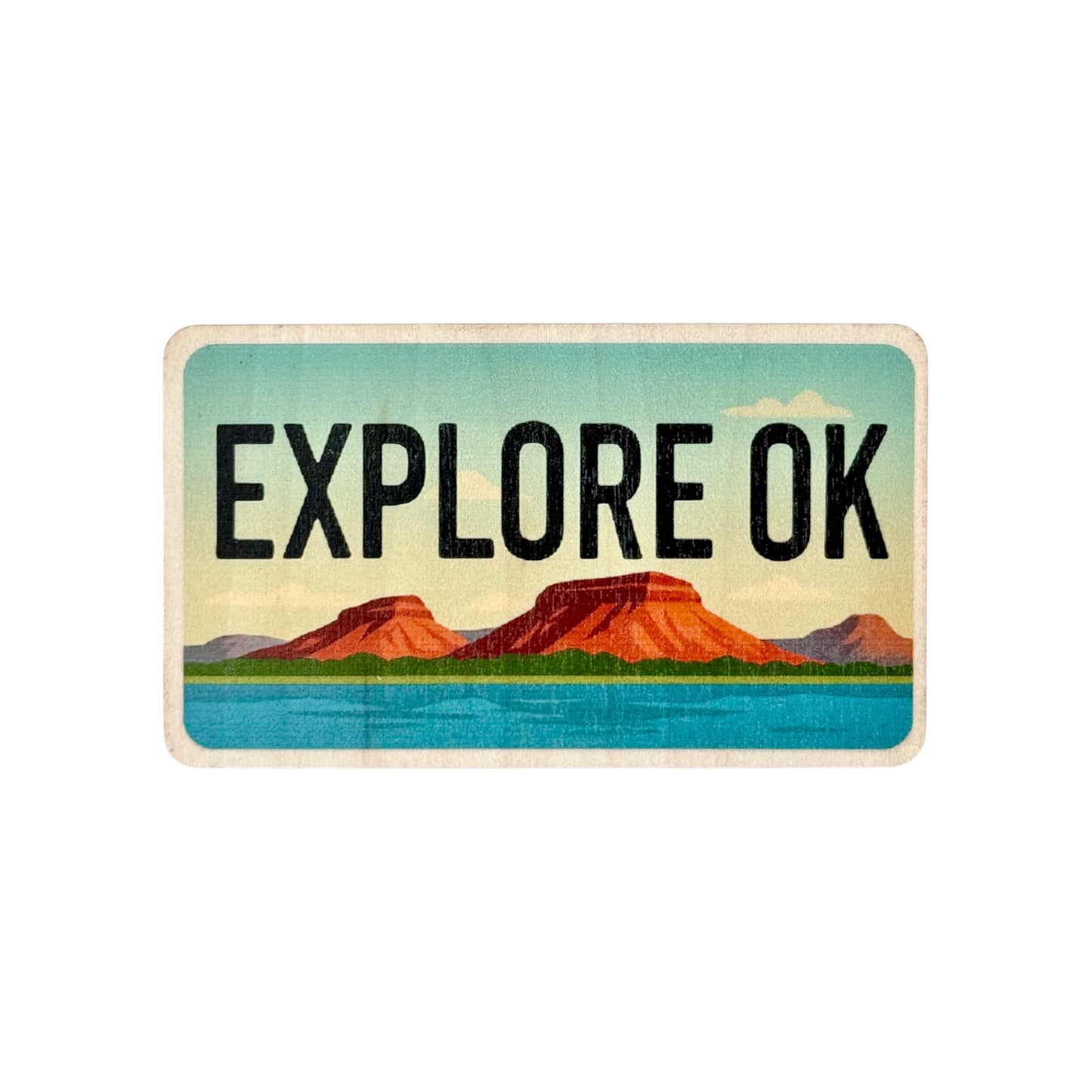 Rectangular wood sticker featuring the phrase “Explore OK” with a colorful illustration of Oklahoma’s mesas and lakes.
