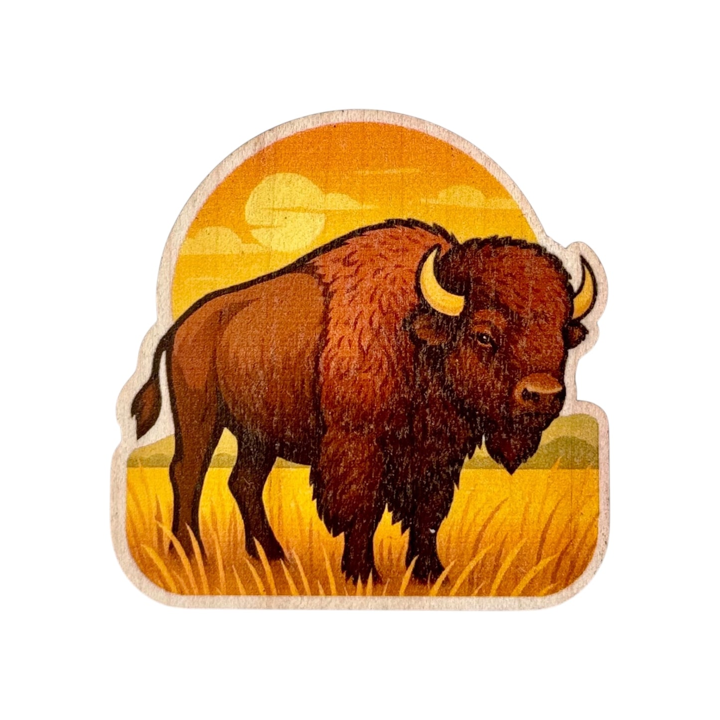Colorful wood sticker of an American Bison standing in golden Oklahoma prairie grass with a sunset in the background