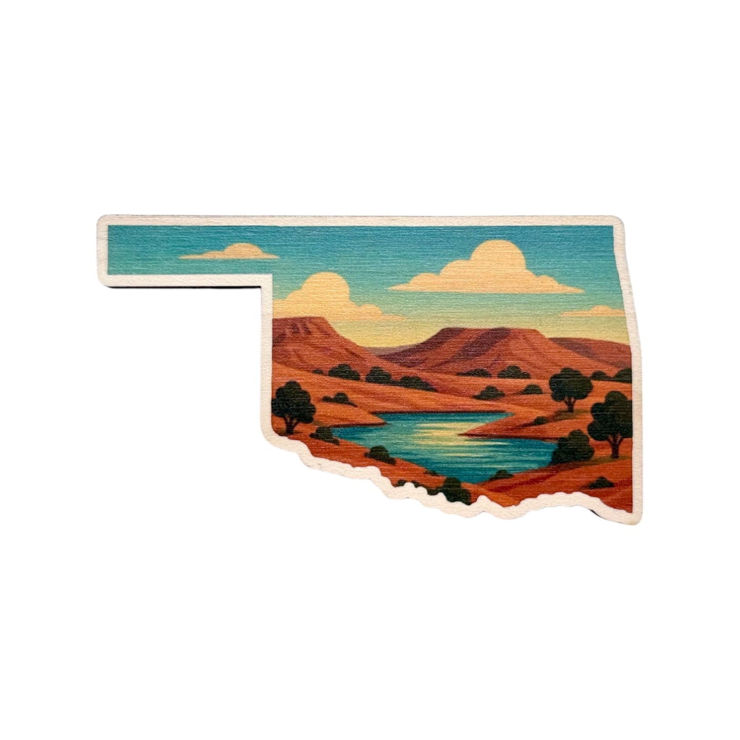 Oklahoma shaped maple wood fridge magnet with colorful illustration of red mesas winding river and trees against a turquoise sky