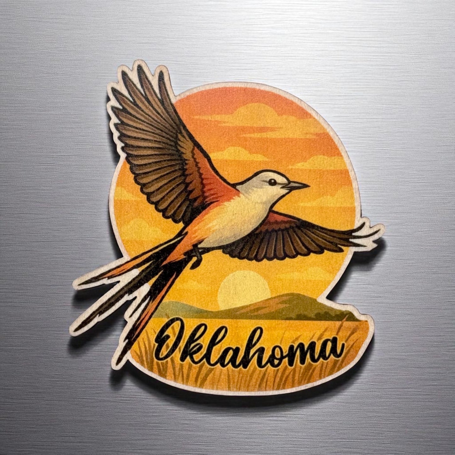 Front view of Oklahoma flycatcher wood magnet on metal fridge with vibrant colors and scenic background in a lightweight handcrafted design