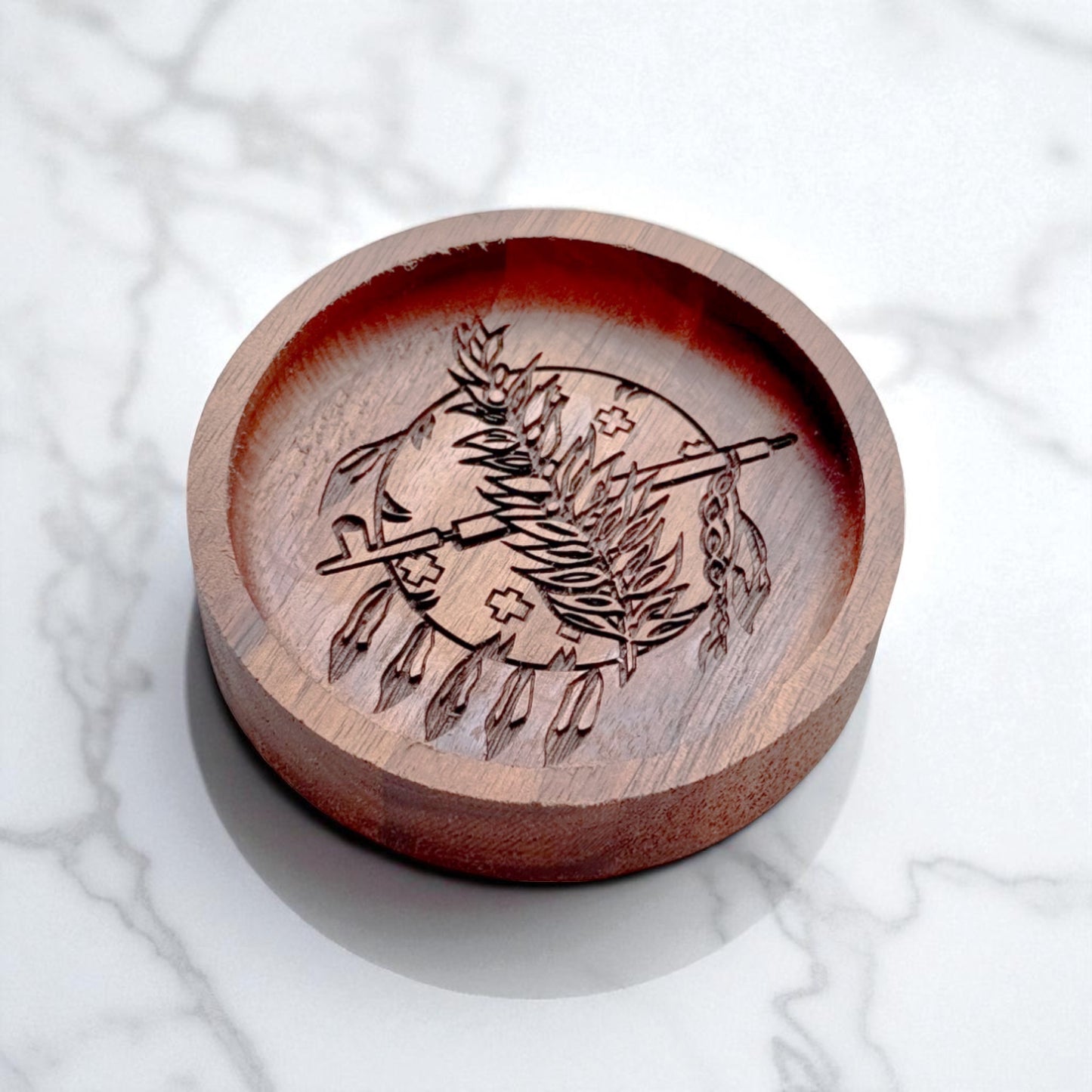 Engraved walnut ring tray featuring Oklahoma state emblem, shown at an angle on a white marble surface