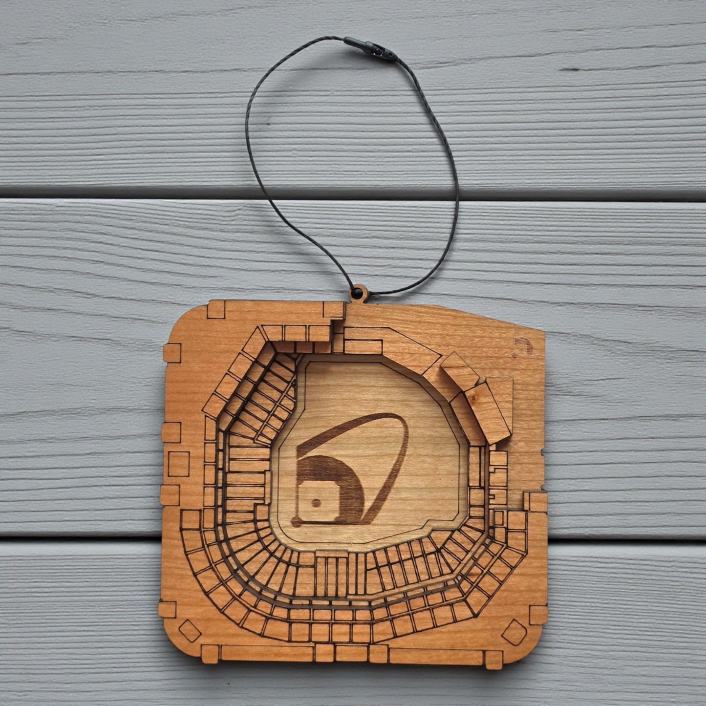 Flat lay of Busch Stadium wooden ornament with engraved seating and field layout, baseball stadium ornament made from wood for MLB fan decor