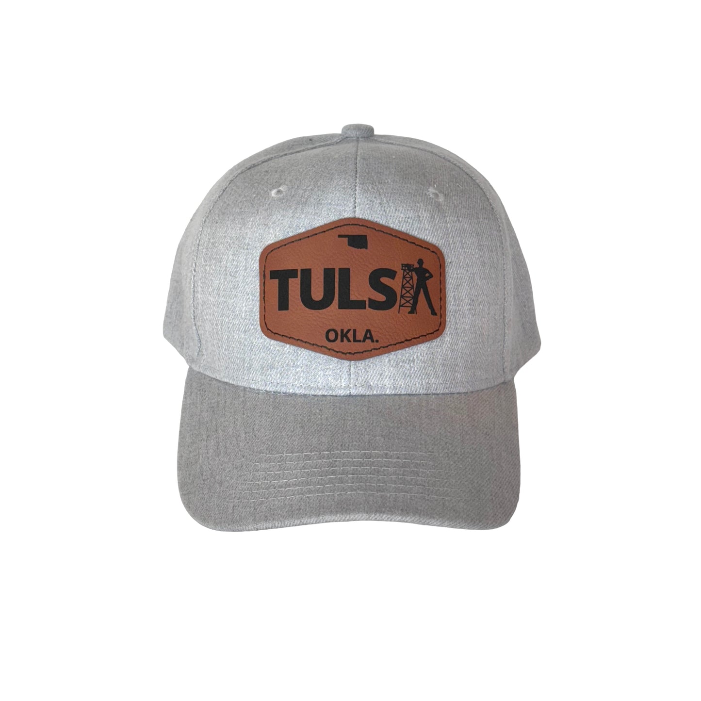 Gray velcro hat showcasing a leather patch reading “TULSA,” highlighting the “A” as the Golden Driller icon.