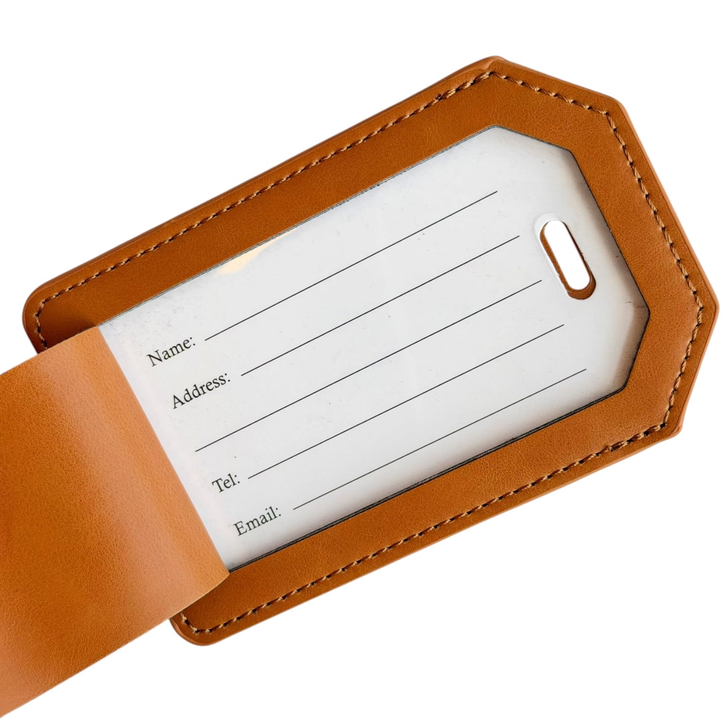 Close-up of tan leatherette luggage tag with covered traveler information card showing spaces for name, address, telephone number, and email for identifying luggage during travel