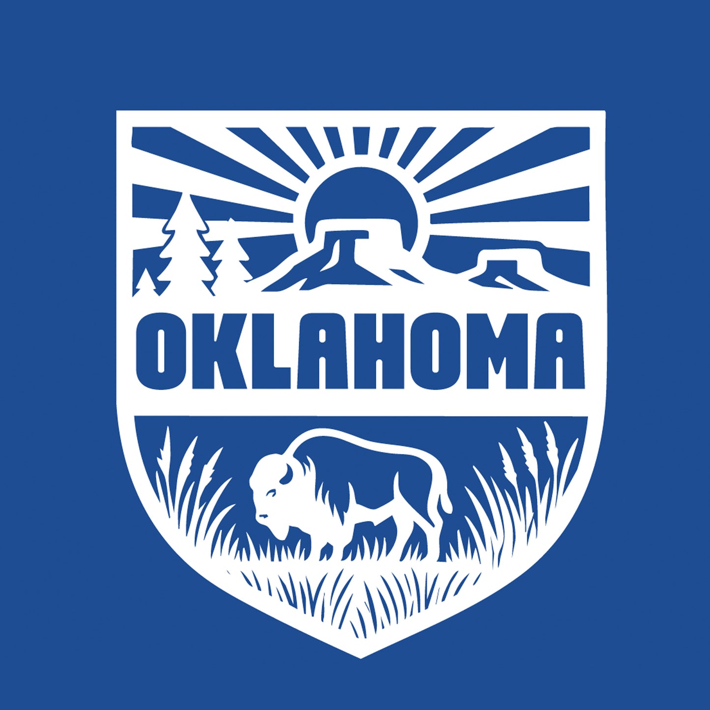 Close up of white Oklahoma shield design with bison and sunset rays on blue t shirt, Oklahoma travel and souvenir apparel