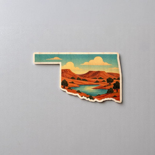 Oklahoma landscape wooden veneer sticker displayed on a flat surface showing state outline, printed scenic artwork, and natural wood grain edges for Oklahoma gift or souvenir use