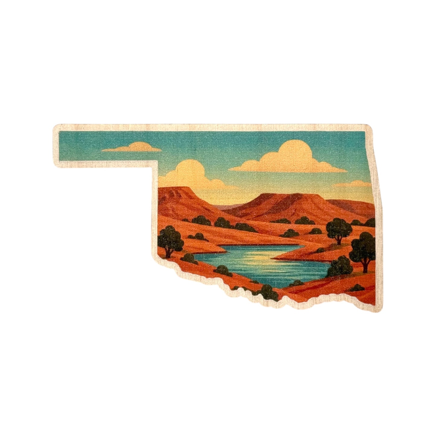 Colorful wooden sticker shaped like Oklahoma featuring a scenic landscape of red plateaus, green trees, and a winding river under a blue sky