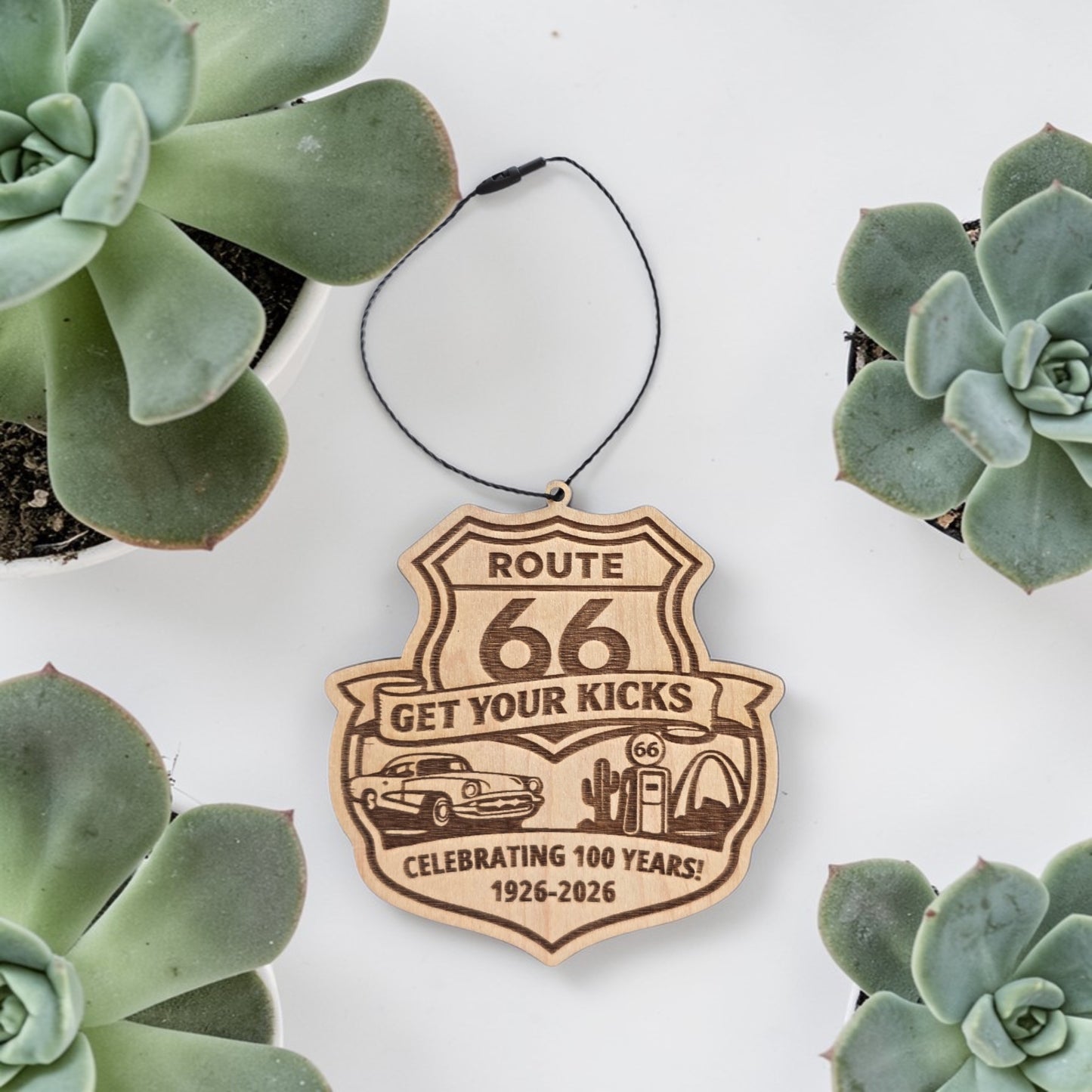 Route 66 Centennial shield wood ornament styled with succulents on white background, engraved road trip keepsake gift for Route 66 fans