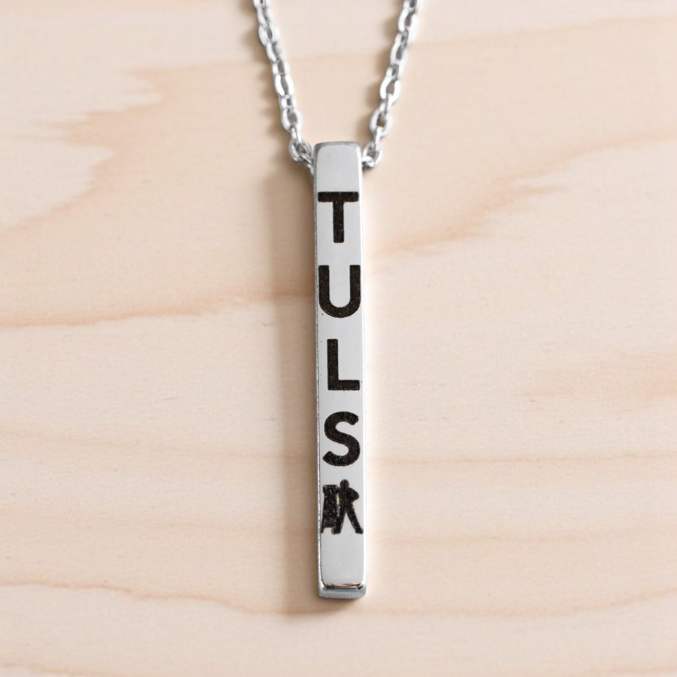 Silver vertical bar necklace with TULSA and Driller engraving, modern souvenir from Tulsa