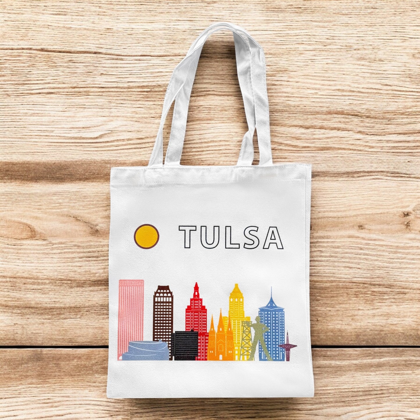Small Tulsa Oklahoma LGBTQIA pride skyline tote bag standing upright, reusable pride souvenir tote
