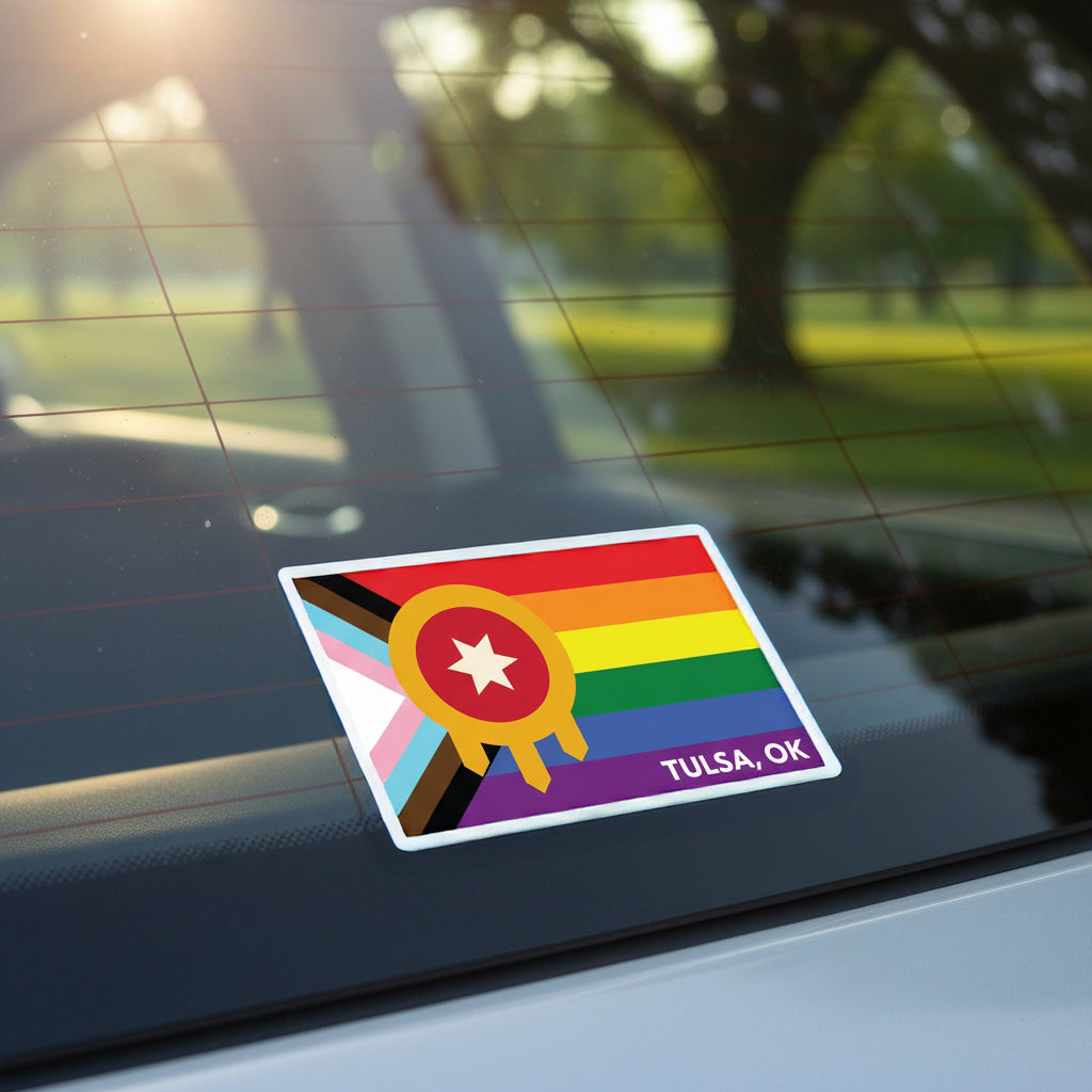 Tulsa Pride vinyl sticker applied to car rear window, colorful Progress Pride and Tulsa flag design used as Oklahoma LGBTQ car decal