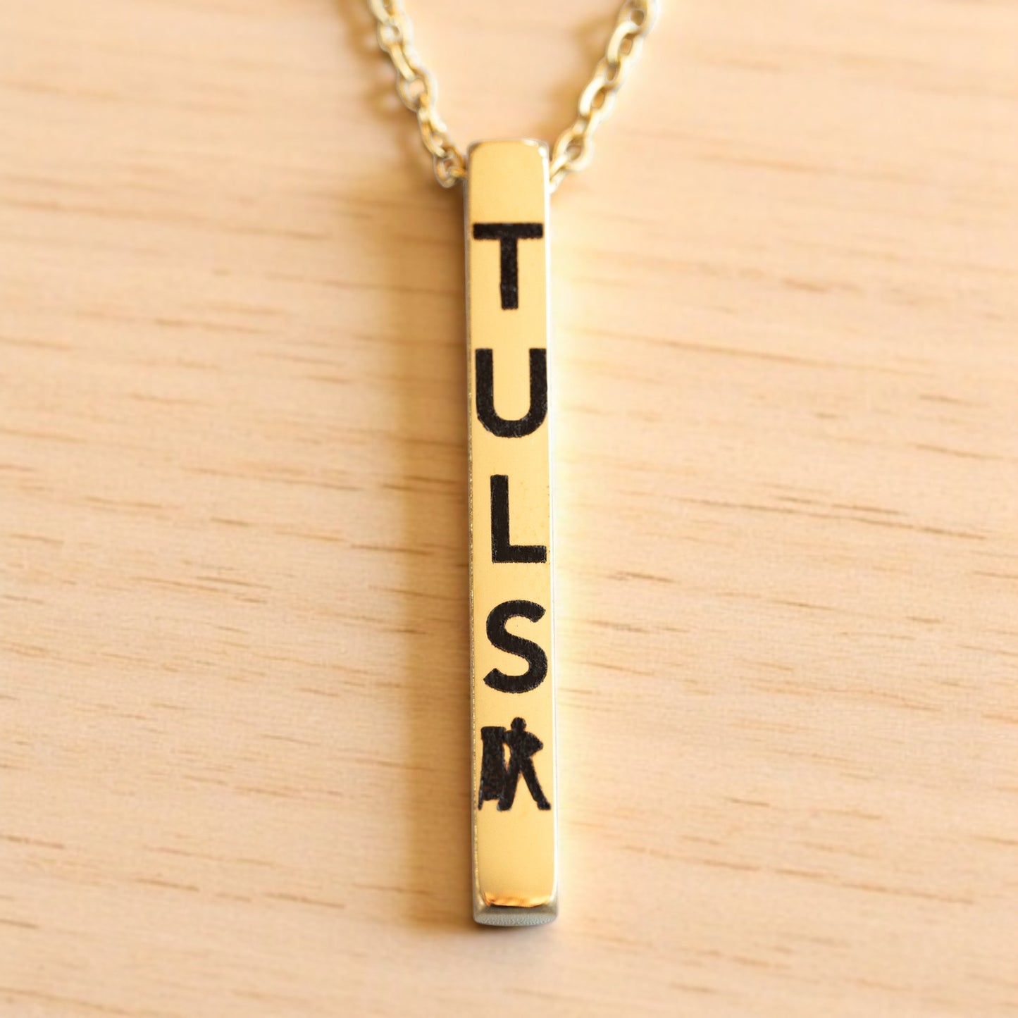 Gold vertical bar necklace engraved with TULSA and Tulsa Driller icon, minimalist Oklahoma jewelry gift