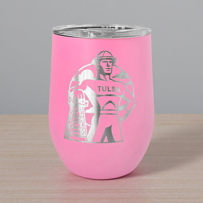 Pink 12oz wine tumbler with a laser etched Tulsa Golden Driller design, shown on a wood tabletop with a clean neutral background. This stemless insulated wine tumbler is a popular Tulsa themed gift, Oklahoma souvenir, and practical piece of drinkware for wine lovers, visitors, and local shoppers.