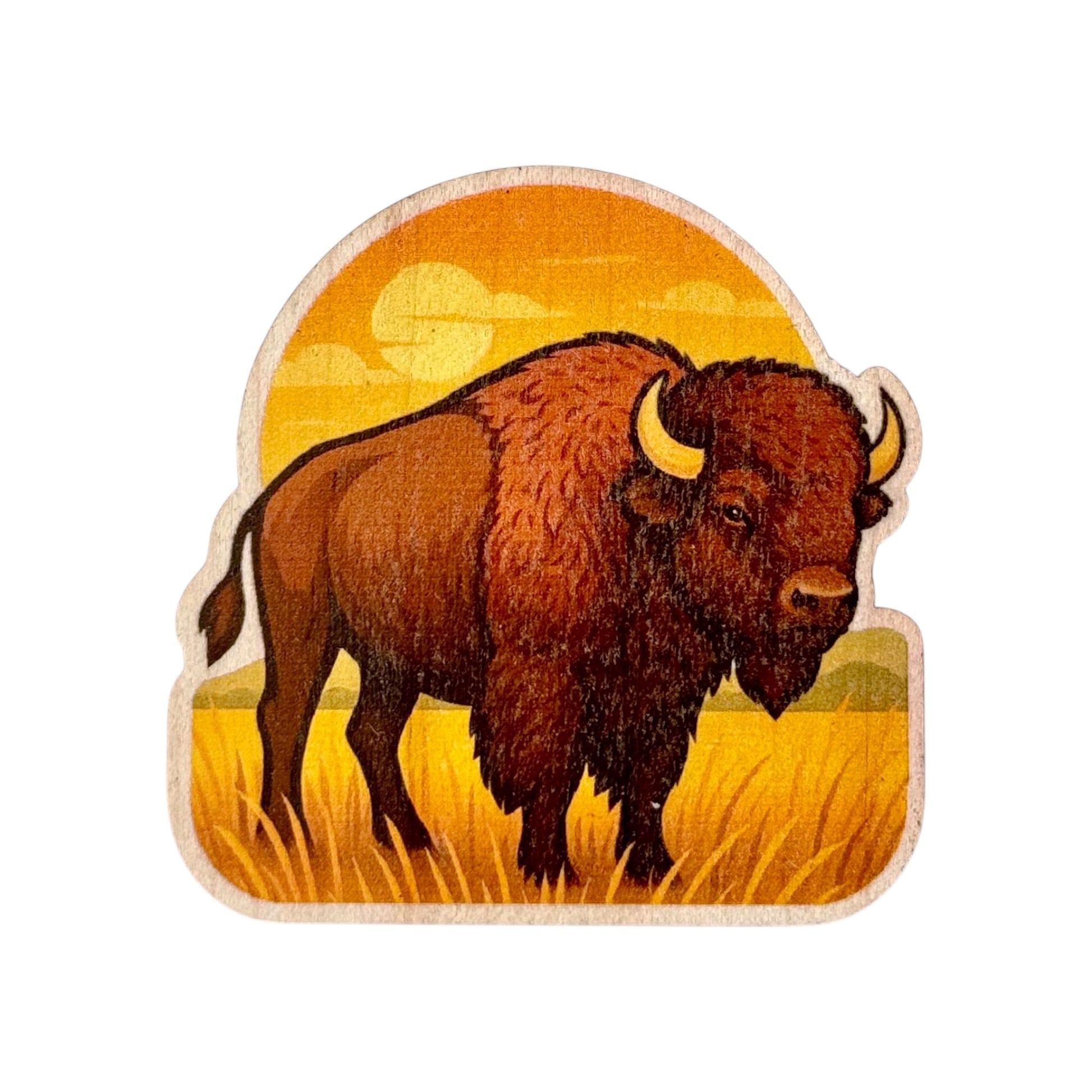 Colorful wood sticker of an American Bison standing in golden Oklahoma prairie grass with a sunset in the background