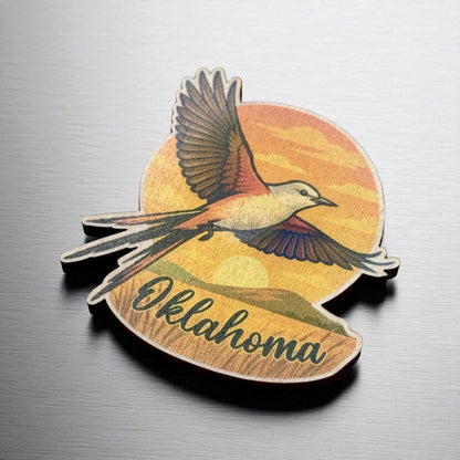 Angled view of maple wood magnet showing soaring state bird and bold Oklahoma script across a sunset landscape with rounded edge and precise cut