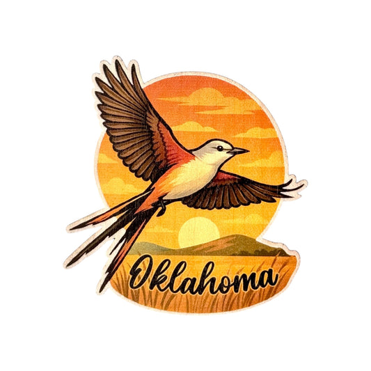 Colorful wood sticker of Oklahoma’s state bird, the Scissor-tailed Flycatcher, soaring in front of an orange sunset with rolling hills and “Oklahoma” text