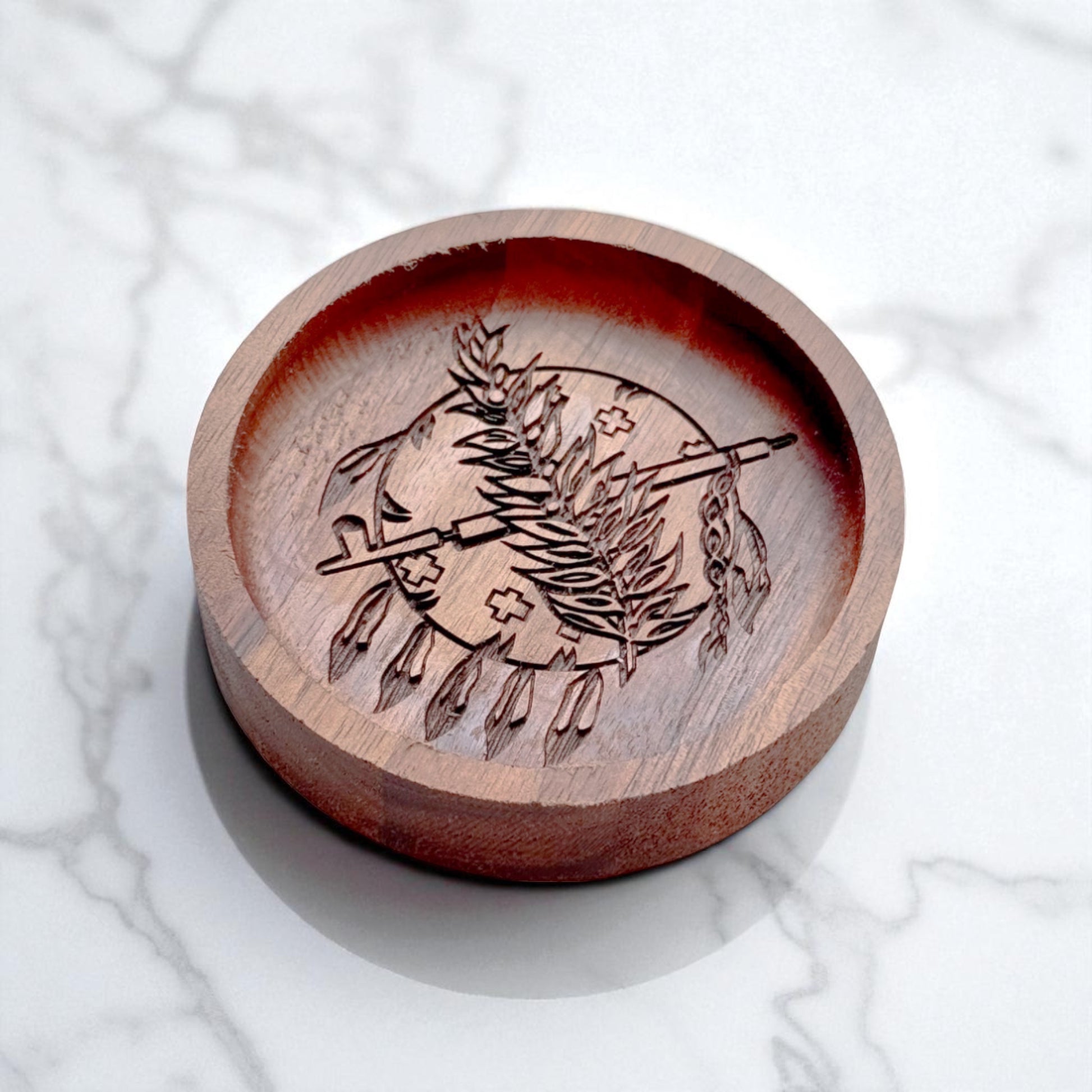 Engraved walnut ring tray featuring Oklahoma state emblem, shown at an angle on a white marble surface