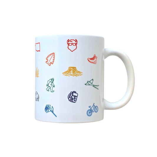 White ceramic coffee mug with colorful Oklahoma icons including bison, rose, scissortail, and Gloss Mountains.