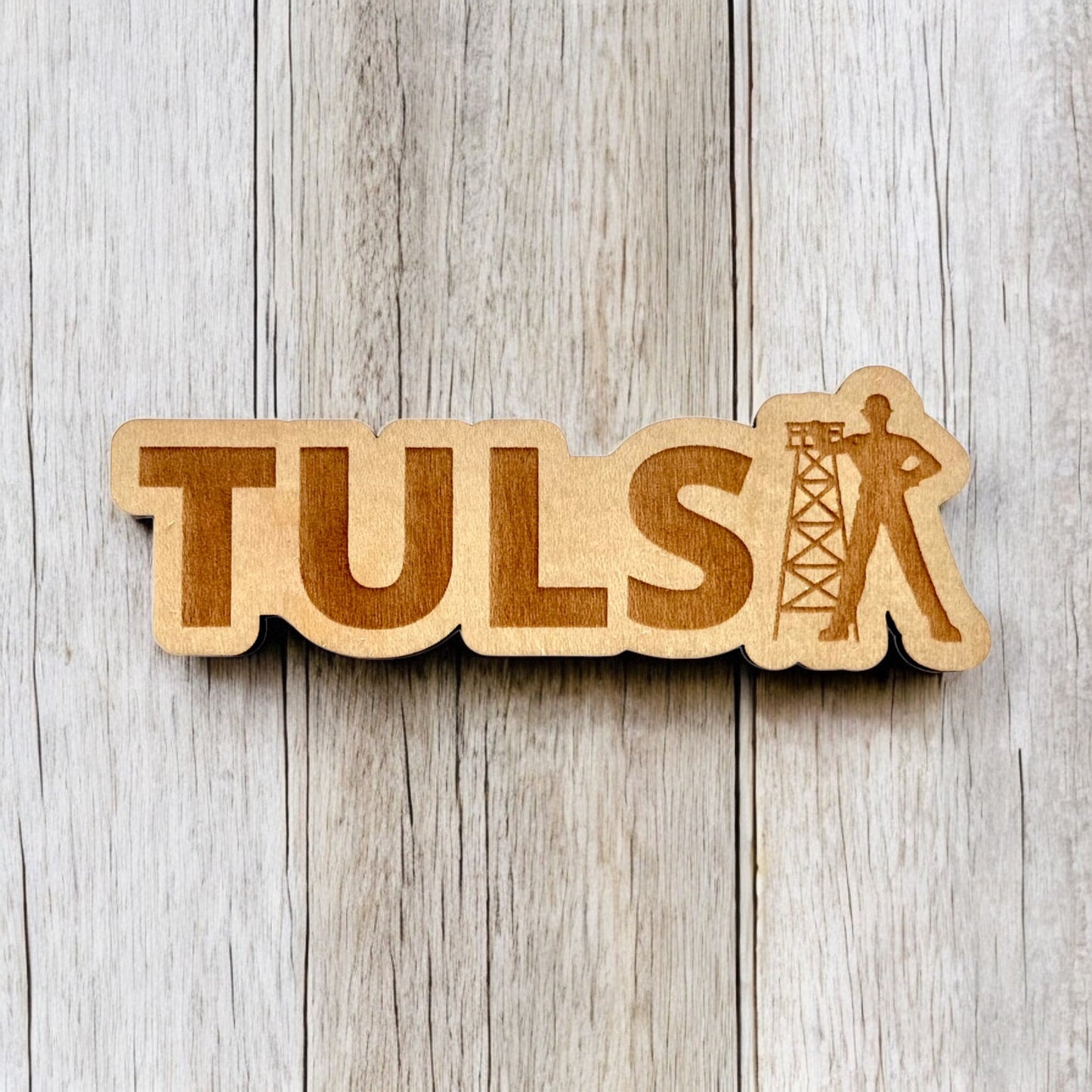 Tulsa wooden magnet showing laser cut TULSA text and Golden Driller figure displayed on wood surface