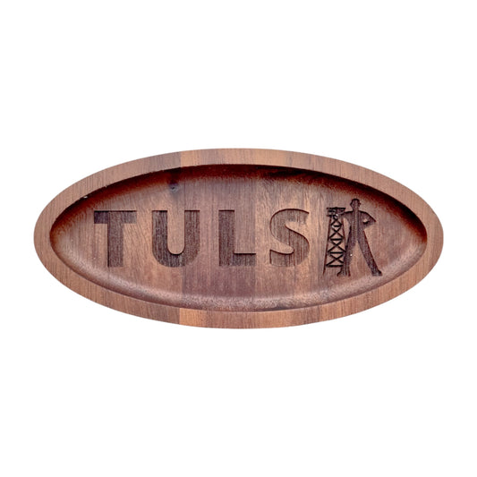 Oval walnut wood tray engraved with the word “TULSA” and Golden Driller silhouette, isolated on white background