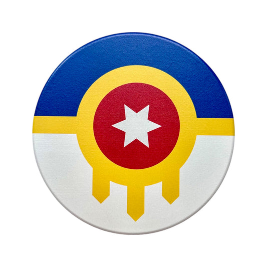 Tulsa Flag ceramic coaster featuring bold blue, yellow, red and white design on a 4 inch round surface with cork backing, perfect Oklahoma home gift or Tulsa souvenir.