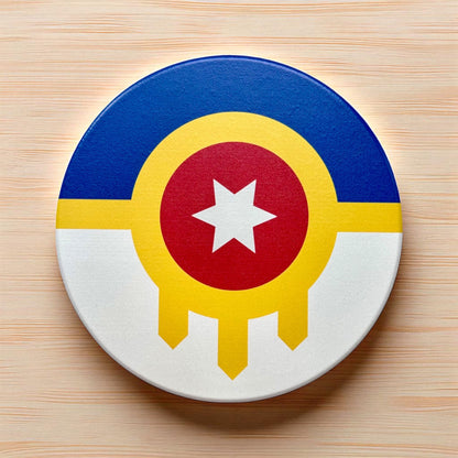 Round coaster with a colorful design featuring a blue circle, yellow ring, red center with a white star, and white border on a wooden surface.