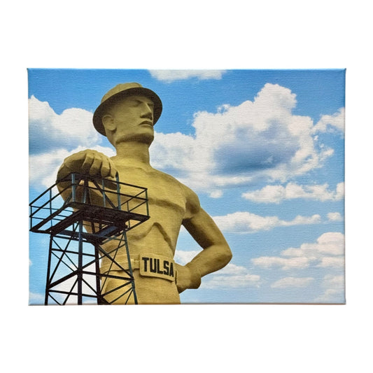 Close-up of Tulsa Golden Driller statue canvas art featuring a bright blue sky and detailed texture, shown against a plain white background.