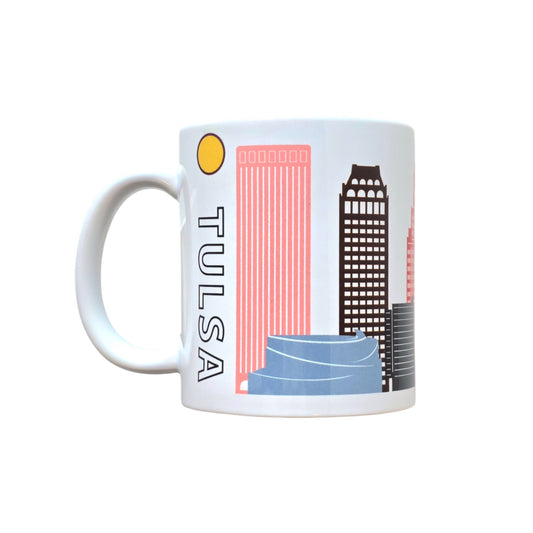 White ceramic mug with Tulsa skyline and rainbow-colored buildings.