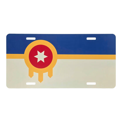 Tulsa flag vanity license plate featuring the red, gold, blue, and cream design on a white background.