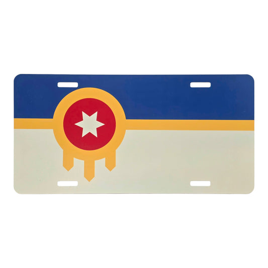 Tulsa flag vanity license plate featuring the red, gold, blue, and cream design on a white background.