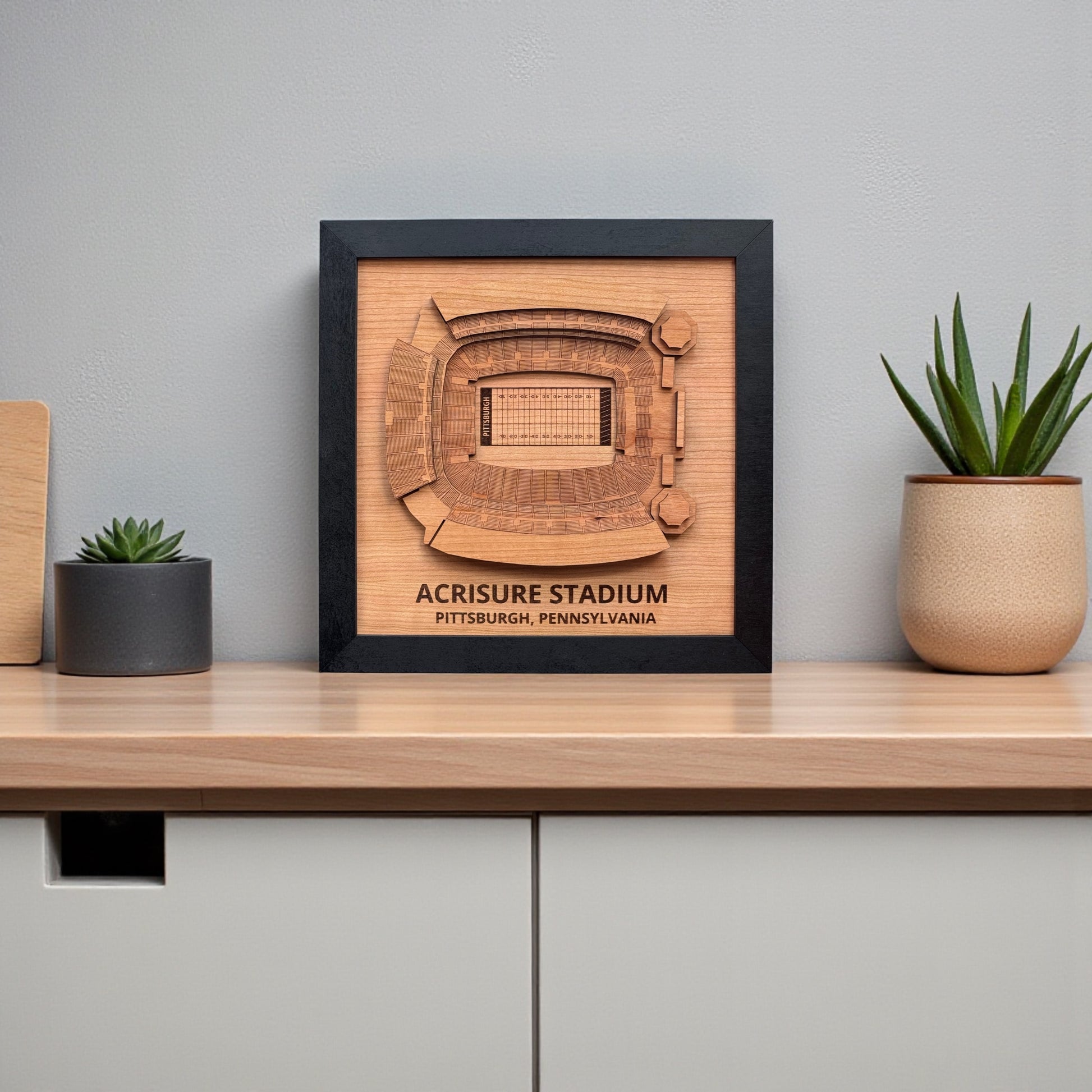 Acrisure Stadium wooden wall art displayed on shelf with modern decor, framed Pittsburgh football stadium map artwork