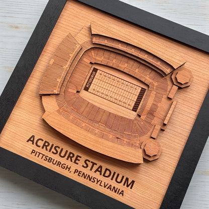 Angled view of Acrisure Stadium layered wooden wall art in black frame, engraved Pittsburgh football stadium map for office or home decor