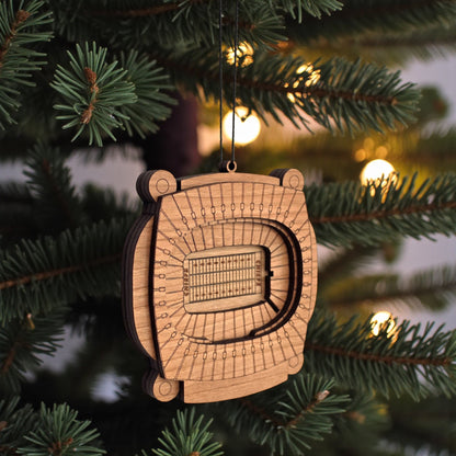 Angled view of Arrowhead Stadium wooden ornament hanging from black cord, layered wood Kansas City football stadium ornament for sports fan gift