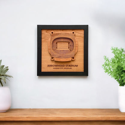 Arrowhead Stadium wooden wall art displayed on a white wall above a wood console
