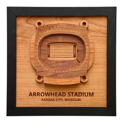 Framed wooden wall art showing a top down view of Arrowhead Stadium with engraved stadium name and city