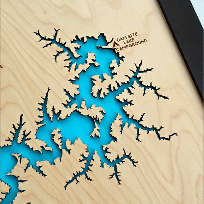 Detailed close-up of Beaver Lake laser-cut wooden map showing blue water layers and engraved shorelines, handcrafted by The Curious Bison.
