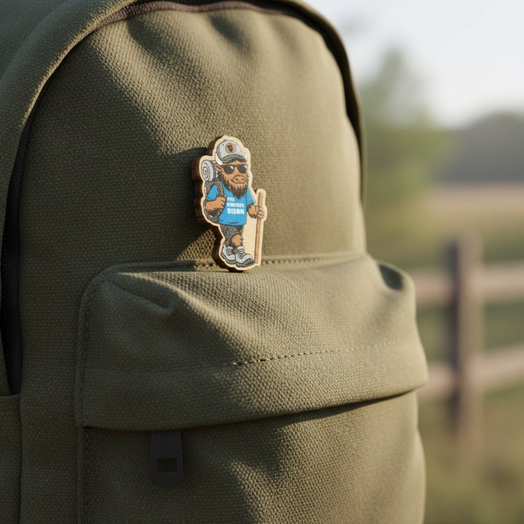 Hiking bison mascot wooden lapel pin attached to backpack, fun travel pin for hikers, campers, and outdoor adventure gifts