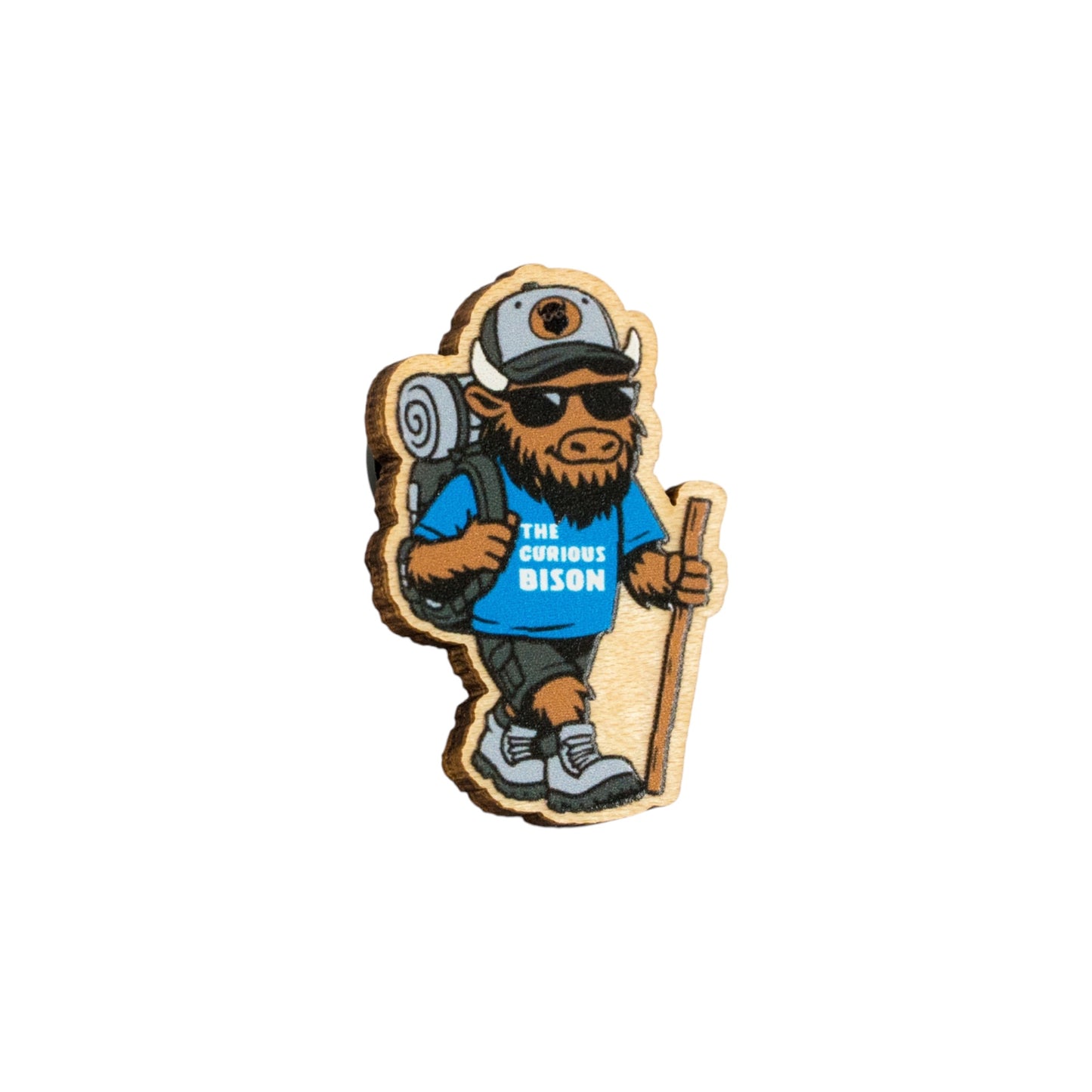 Eco Wood Birch bison lapel pin isolated on white background featuring hiking mascot with backpack, walking stick, sunglasses, and adventure outfit