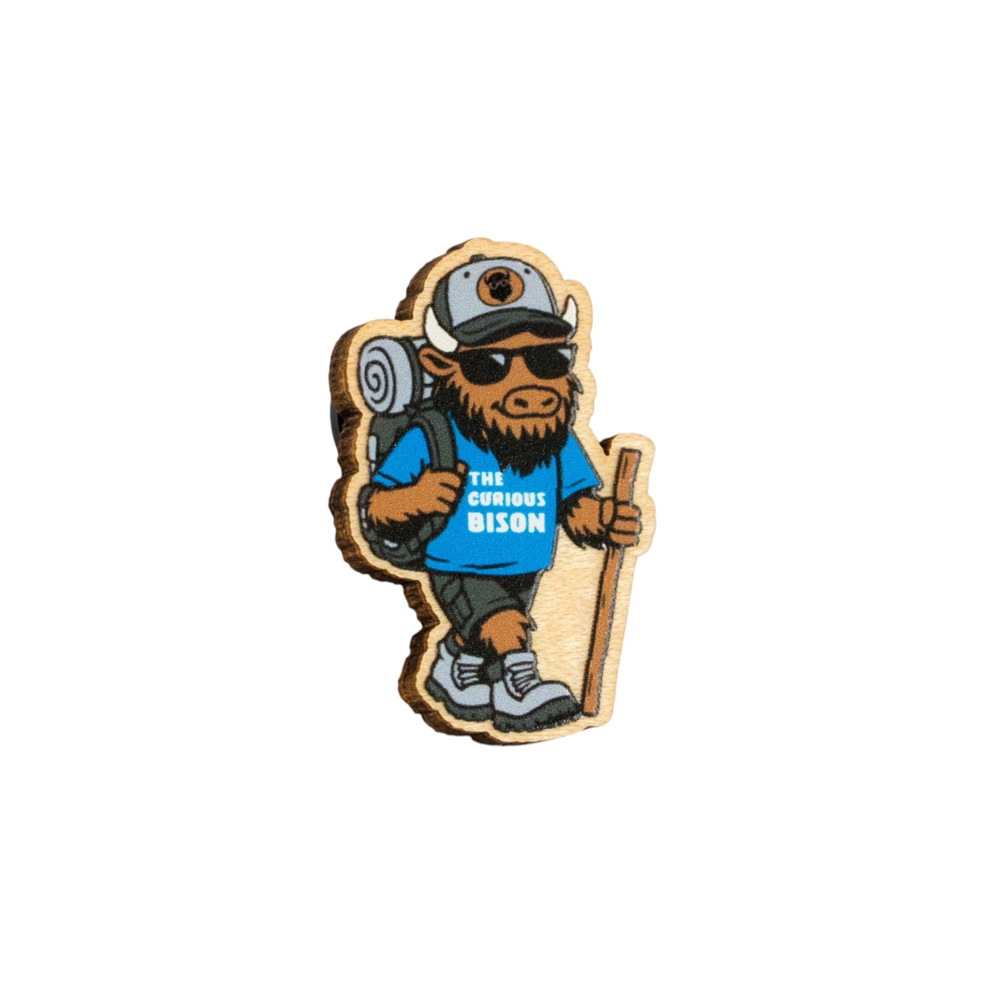 Eco Wood Birch bison lapel pin isolated on white background featuring hiking mascot with backpack, walking stick, sunglasses, and adventure outfit