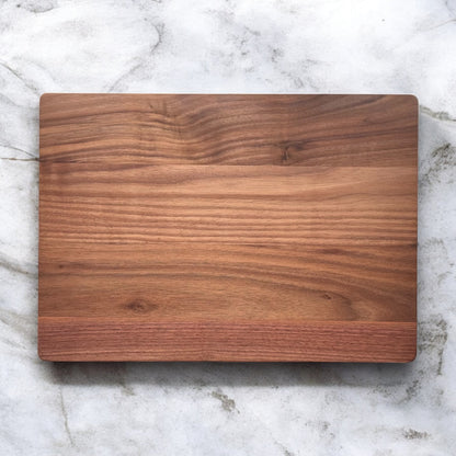Plain walnut cutting board showing natural grain pattern and smooth food safe finish