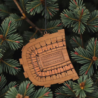 Boone Pickens Stadium wooden ornament hanging on evergreen tree with lights, laser cut OSU football stadium ornament used as college football Christmas decor