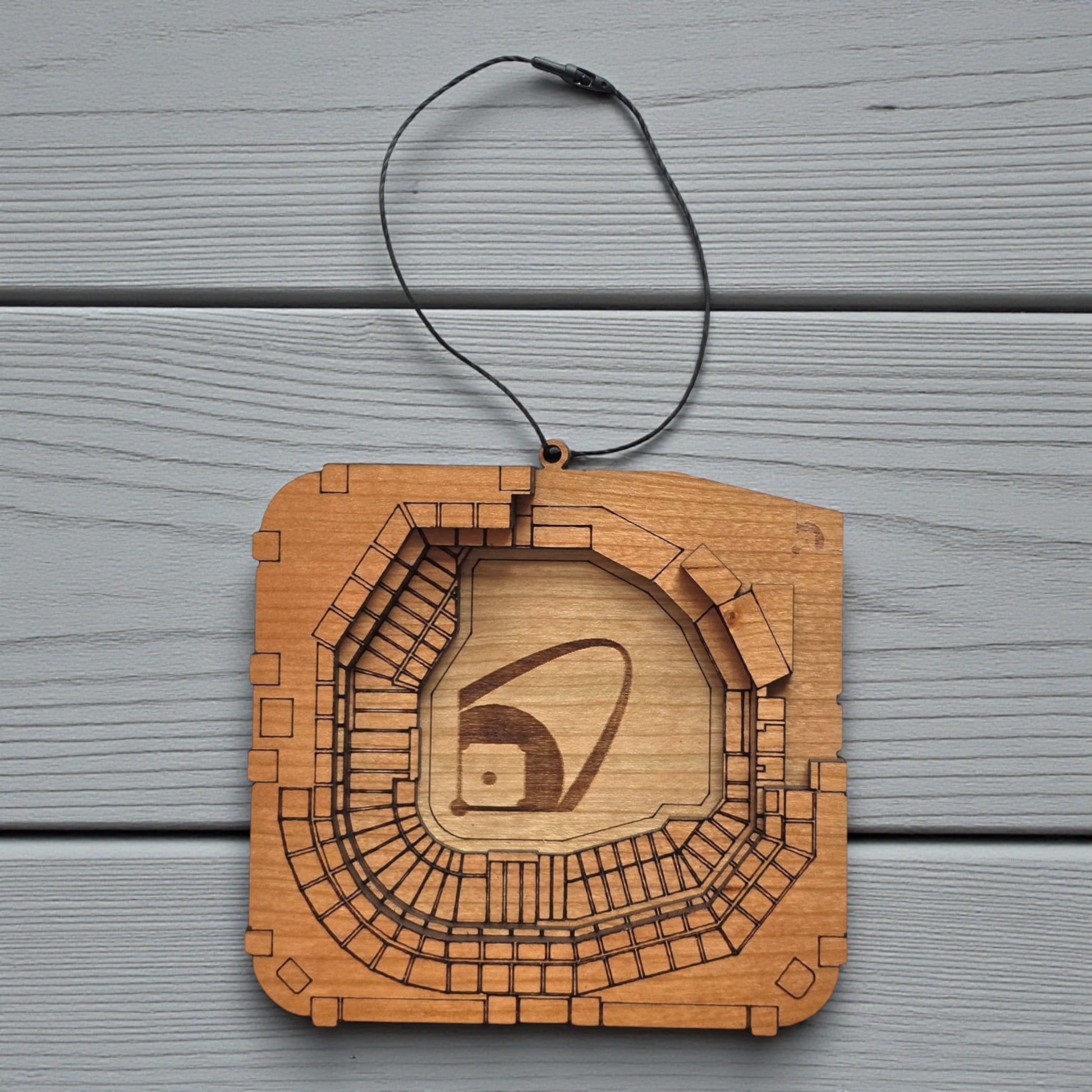 Flat lay of Busch Stadium wooden ornament with engraved seating and field layout, baseball stadium ornament made from wood for MLB fan decor