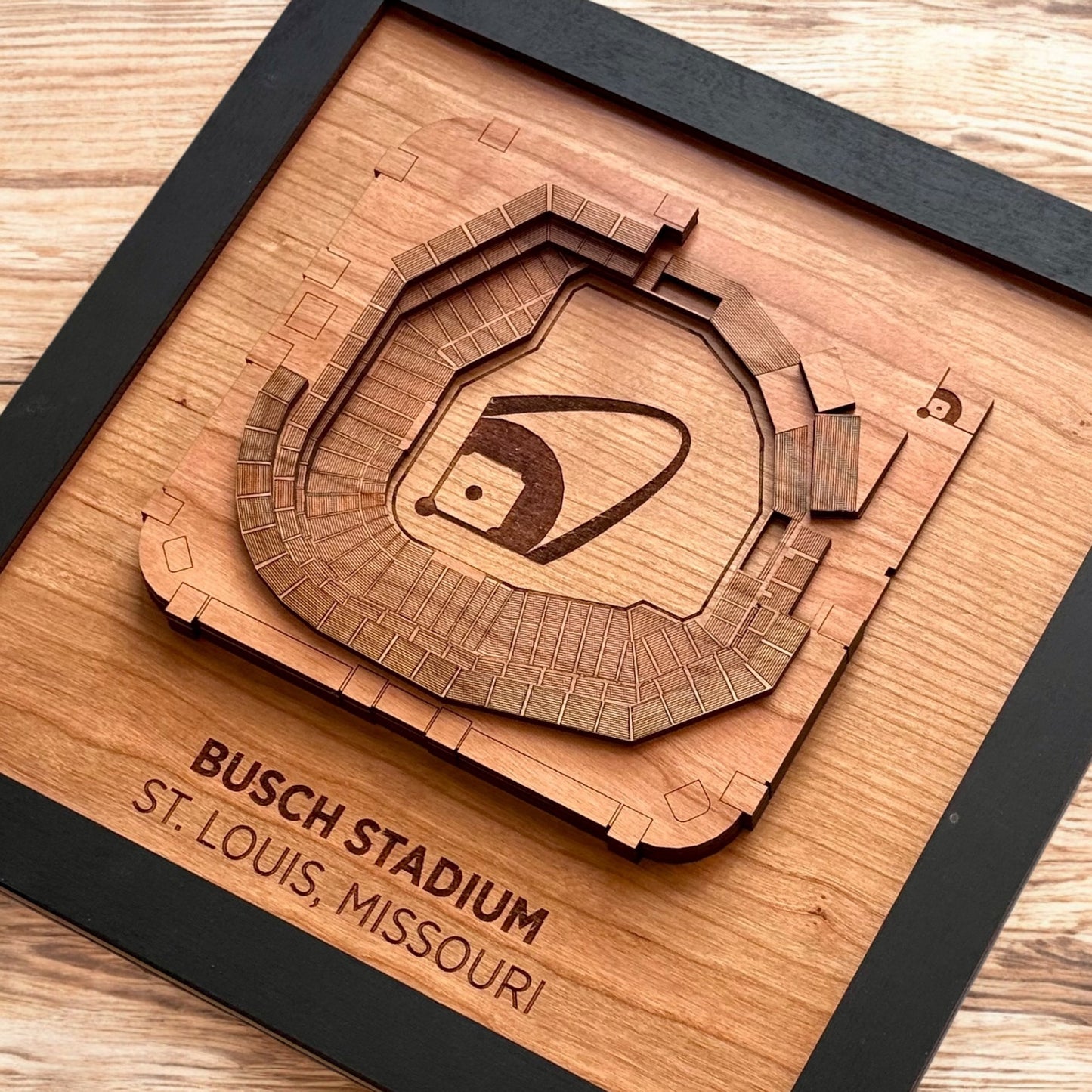Close up of layered wooden Busch Stadium art showing engraved seating sections and field detail