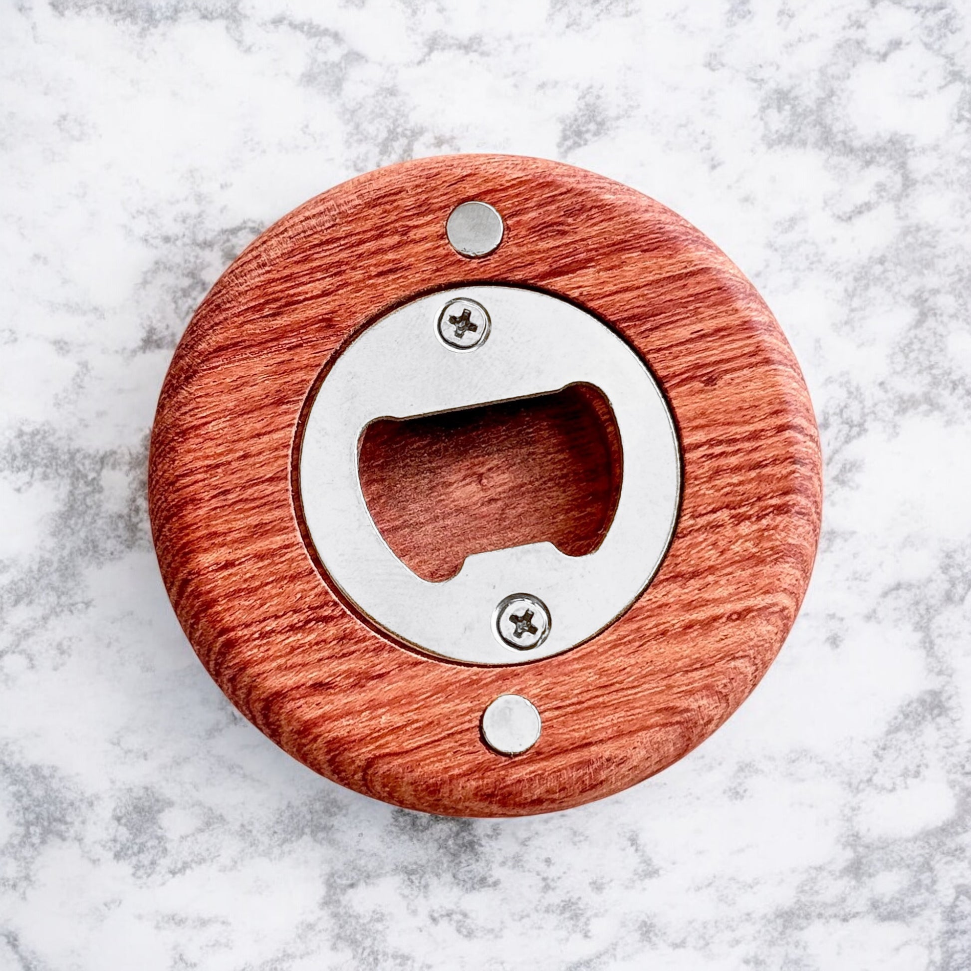 Back view of a cherry wood bottle opener showing the stainless steel opener insert and magnet