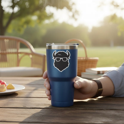 Curious Bison logo vinyl sticker displayed on blue insulated tumbler, black bison head with glasses small business sticker