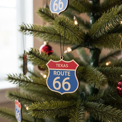 Eight state collection  Route 66 shield ornament displayed on a decorated Christmas tree with holiday lights and additional Route 66 ornaments in the background, Americana travel themed holiday decor