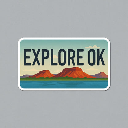 Explore OK vinyl sticker shown on neutral gray background, rounded license plate style Oklahoma travel sticker with scenic red rock and lake design