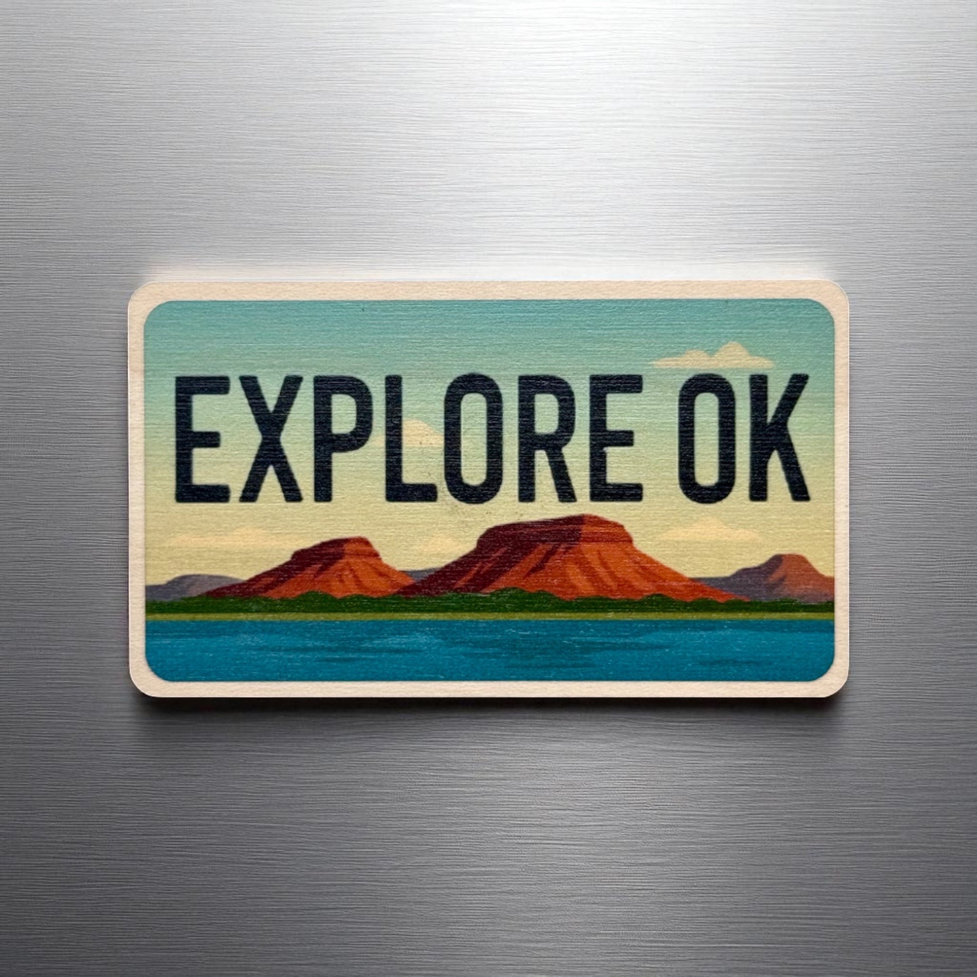 Explore Oklahoma wooden magnet displayed on a metal surface, license plate style Oklahoma magnet with scenic landscape design