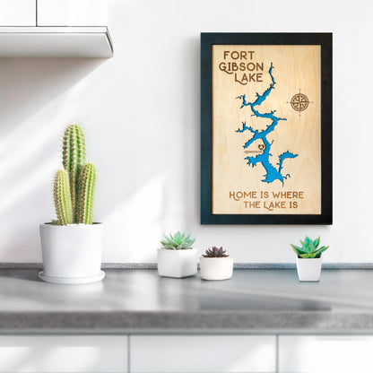 Fort Gibson Lake wooden map wall art displayed above a countertop with plants